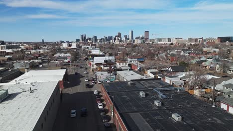 Cars-drive-along-one-way-road-heading-into-downtown-urban-city-of-Denver-Colorado-from-outlying-suburbs