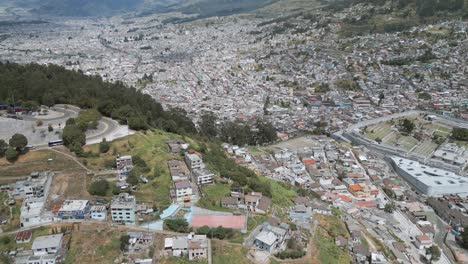 A-wide-aerial-view-of-the-hill-El-Panecillo-in-Ecuador,-Quito
