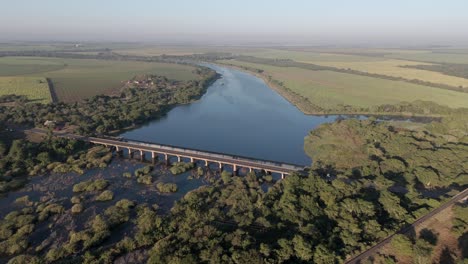 Bridge-crossing-Komati-River-to-Komatipoort-South-Africa,-panoramic-static-aerial