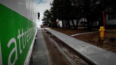 Moving-Delivery-Truck-Drives-Through-Small-Town-Community