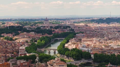 Birds-Eye-Aerial-View-Above-Tiber-River,-Ponte-Sisto-and-Vatican-City-in-Background