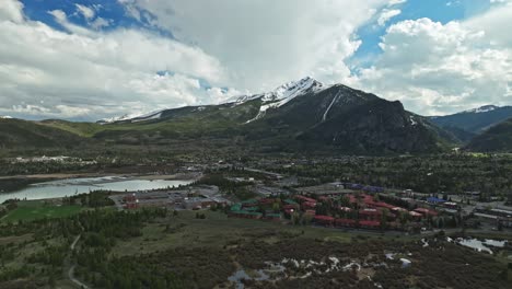 Aerial-estabilshing-dolly-of-snow-on-mountain-slopes-above-Frisco-Colorado-on-cloudy-day