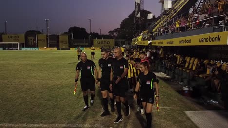 Start-of-the-Children's-Tournament-Final-with-official-referees-on-the-official-field-in-Asuncion-Paraguay