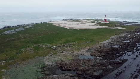 The-lighthouse-and-seabird-colony-of-Cape-Gannets-on-the-protected-marine-reserve-of-Bird-Island-in-Southern-Africa