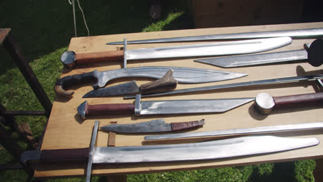 Amazing-slow-motion-shot-of-swords-being-made-and-displayed-at-a-medieval-fair-booth-in-southern-Spain