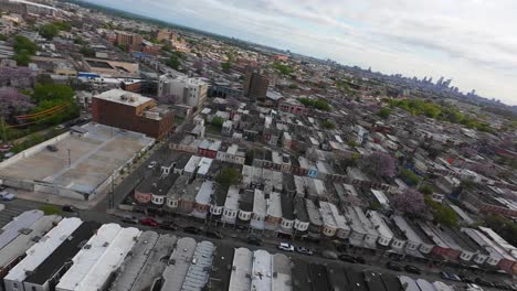 High-aerial-FPV-drone-shot-of-row-houses-in-American-city-suburb