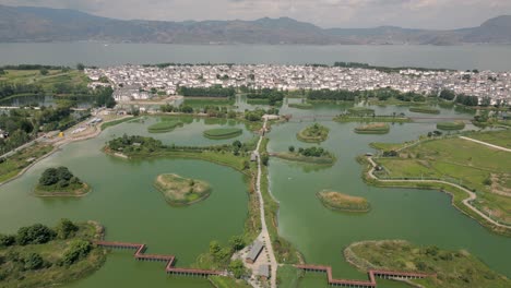 Drone-footage-of-a-majestic-garden-next-to-the-Xi-Zhou-Paddy-Fields