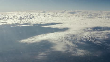 Aerial-view-from-airplane-window-of-clouds-in-sky