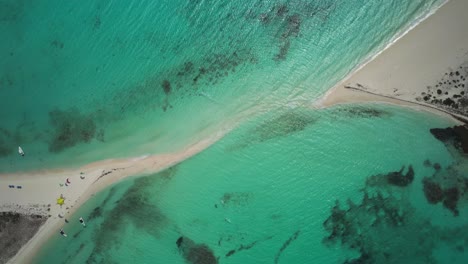 A-turquoise-beach-with-a-sandbar-at-cayo-de-agua,-aerial-view