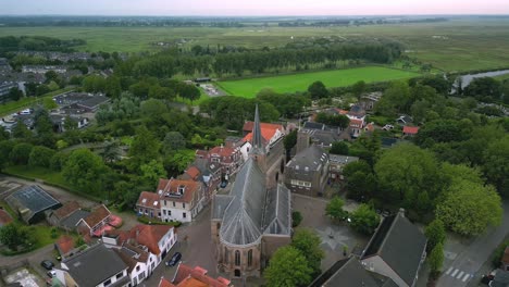 The-historic-village-church-of-Strijen-in-the-Netherlands,-founded-in-the-15th-century,-rear-view