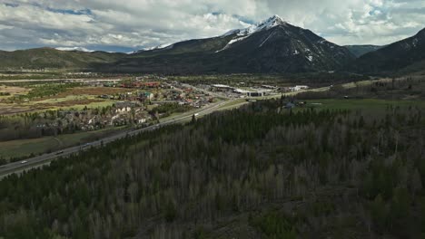 Bare-trees-mixed-with-evergreens-above-highway-leading-to-Frisco-Colorado