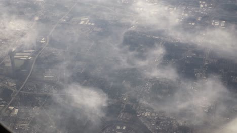 Aerial-view-from-airplane-window-of-clouds-in-sky