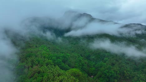 Dense-clouds-covering-green-mountains-on-Biliran-Island,-Philippines