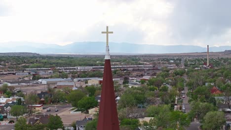 Drone-orbits-golden-cross-on-top-of-sacred-heart-church-in-Pueblo-Colorado