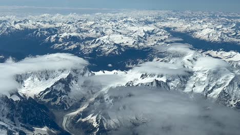 POV-of-The-Alps-Range,-shot-from-an-airplane-cockpit-while-flying-at-8000m-high-northbound