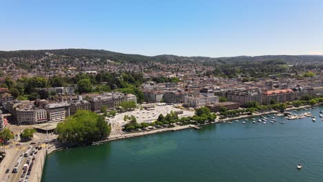 Drone-flyover-shot-over-Lake-Zürich-in-Switzerland-towards-the-Opera-House-of-Zürich