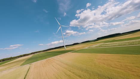 Lonely-wind-turbine-in-middle-of-agriculture-field,-aerial-view