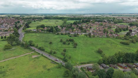 Drone-view-of-Wicksteed-park-with-cityscape-at-background-in-England