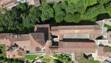 Top-down-flyover-drone-shot-over-evangelical-church-and-castle-in-Aarburg-Switzerland