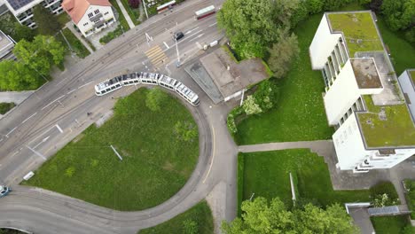 Overhead-drone-shot-of-trams-driving-in-Zürich-Switzerland