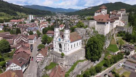 Spiraling-drone-shot-around-evangelical-church-and-castle-in-Aarburg-Switzerland