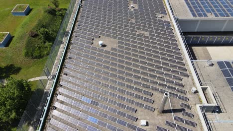 Drone-shot-of-solar-pannels-on-roof-of-industrial-building-in-Zürich-Switzerland