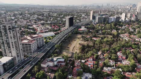 Slow-motion-aerial-view-of-a-highway-in-Mexico-City