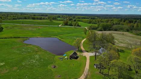 Lush-green-pastures-surrounding-Tukums,-Latvia-during-the-summer-season