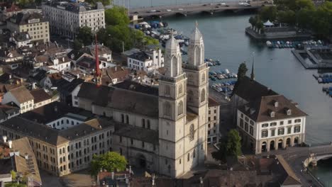 Zoomed-in-drone-shot-circling-around-Grossmunster-cathedral-in-Zürich-Switzerland