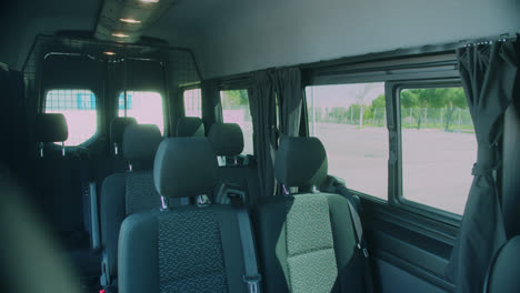 Amazing-slow-motion-shot-of-the-seats-inside-a-very-large,-elegant-and-modern-black-van-for-transporting-musical-bands-in-Madrid
