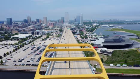 Drone-Flying-Over-Hoan-Bridge-Approaching-The-Downtown-Milwaukee-Skyline