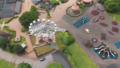 Drone-capturing-giant-wheel-in-Wicksteed-park-during-evening-in-England