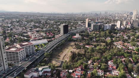 Drone-aerial-view-of-western-Mexico-City-on-a-clear-afternoon