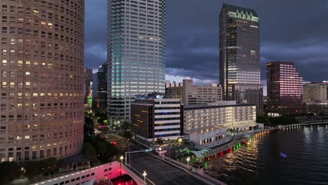 Rising-drone-shot-of-High-rise-Buildings-in-Tampa-at-night,-Florida