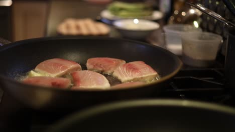 Mahi-Mahi-Fish-Steaks-Cooking-In-A-Sizzling-Pan-Of-Butter