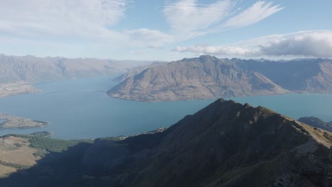 Wide-view-of-Lake-Wakatipu,-Queenstown-and-mountains-on-a-sunny-summer-day-from-Ben-Lomond,-New-Zealand