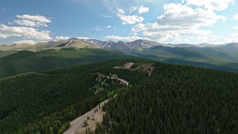 Drone-pullback-above-highway-panoramic-overview-of-Mount-Blue-Sky-Colorado-and-continental-divide