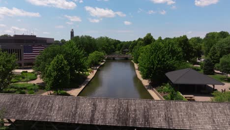 Beautiful-Drone-Shot-Above-Covered-Bridge-in-Downtown-Naperville,-Illinois