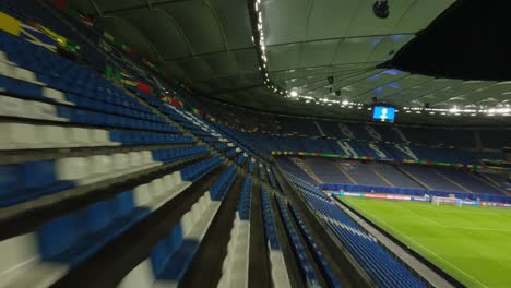 Uefa-Euro2024-Hamburgo-Hsv-Stadion-Luces-De-Inundación-Fpv-Drone-Volando-Sobre-Asientos-Vacíos