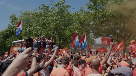 Dutch-Fans-gather-in-Berlin,-Germany,-celebrating-the-European-soccer-championship-2024-with-flags