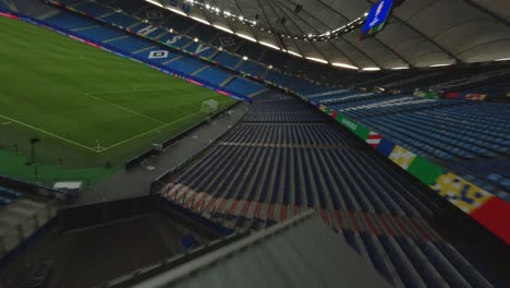 FPV-Drone-HSV-Hamburg-green-football-pitch-empty-stands-and-seats