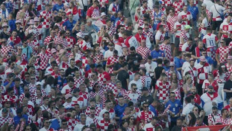 Cheering-fans-from-croatia-fill-the-public-viewing-space-for-the-European-soccer-championship-,-closeup