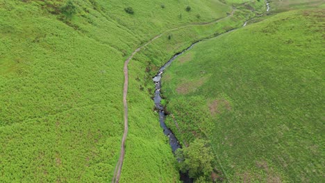 Aerial-footage-of-River-Dane-flowing-through-Dane-Valley-during-morning-in-England