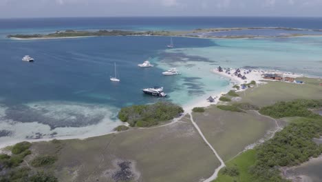 Aerial-shot-of-boats-and-yachts-docked-in-Los-Roques,-Venezuela