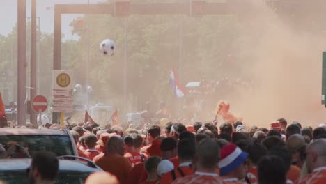 Holland-fans-lunching-orang-smoke-during-a-fan-walk-at-Euro-2024