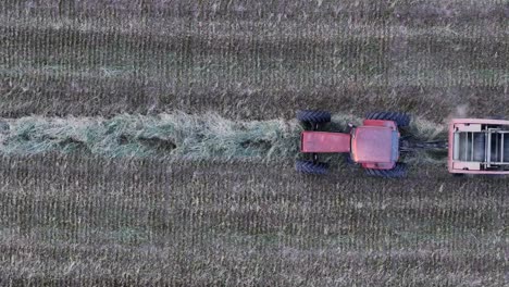 A-farmer-collects-hay-into-a-round-hay-baler-in-Northeast-Wisconsin