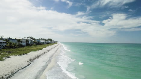 Slow-push-with-ocean-on-the-left-of-frame-and-private-beach-on-the-left