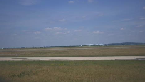 Airplane-window-view-of-a-flight-taking-off-in-the-air