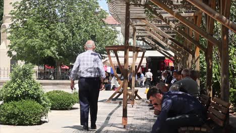 MALATYA---TURKEY---JULY-7,-2017:-PEOPLE-SITTING-IN-THE-PARK-IN-FRONT-OF-THE-NEW-MOSQUE