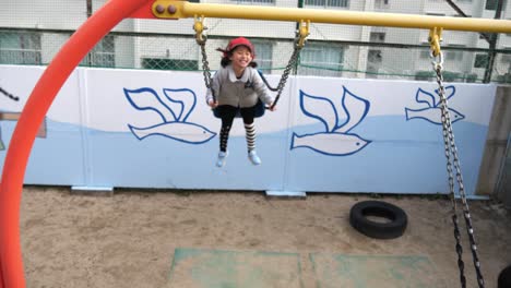 School-kid-on-swing-doing-grimace-twisted-expression